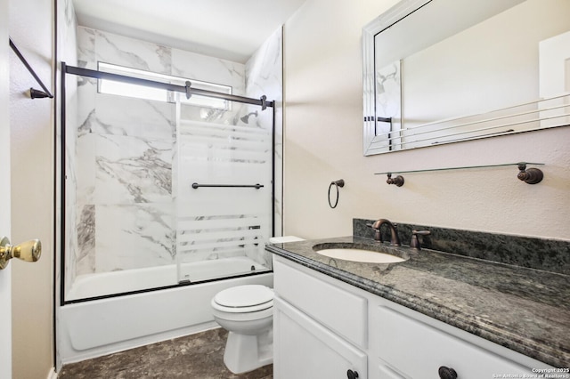 bathroom featuring toilet, vanity, and bath / shower combo with glass door