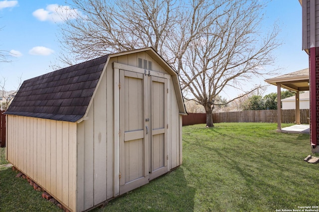 view of shed with fence