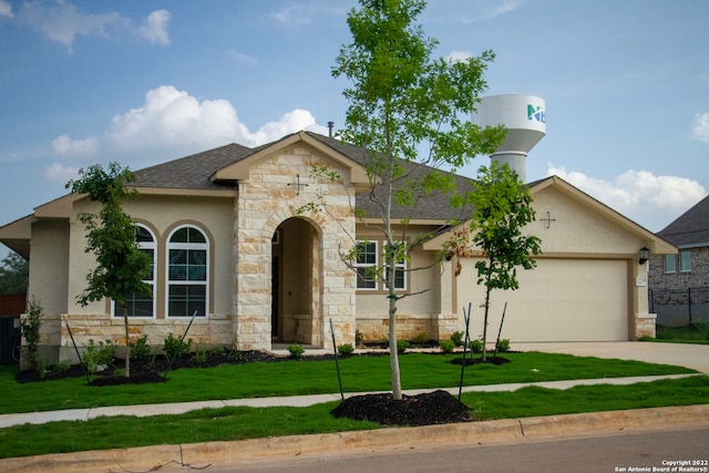 view of front of house with roof with shingles, stucco siding, a front lawn, concrete driveway, and a garage