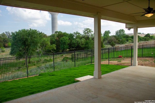 view of patio / terrace with a ceiling fan and fence