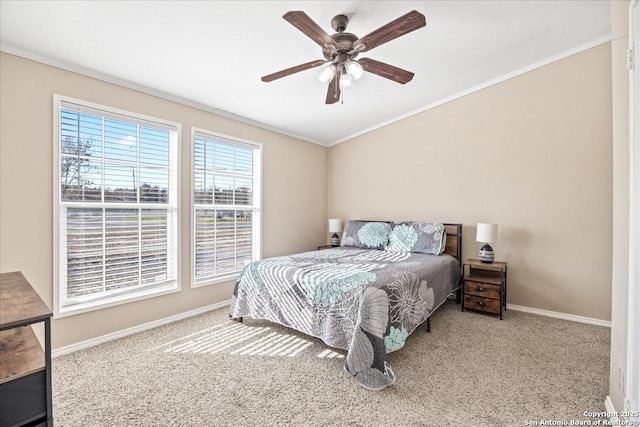 bedroom with carpet flooring, ceiling fan, crown molding, and baseboards