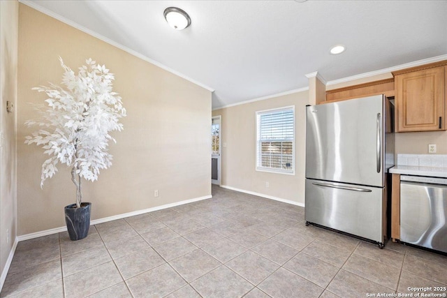 kitchen featuring crown molding, baseboards, light countertops, light tile patterned floors, and stainless steel appliances