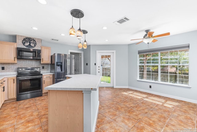 kitchen featuring tasteful backsplash, visible vents, light brown cabinetry, light countertops, and appliances with stainless steel finishes