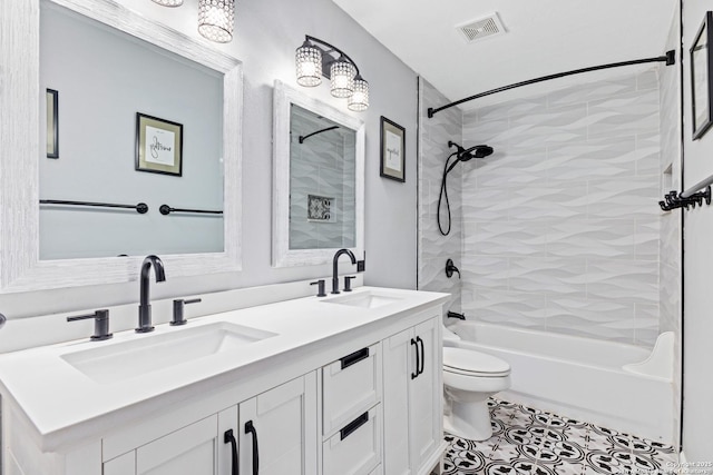 full bathroom featuring toilet, visible vents, shower / bathtub combination, and a sink