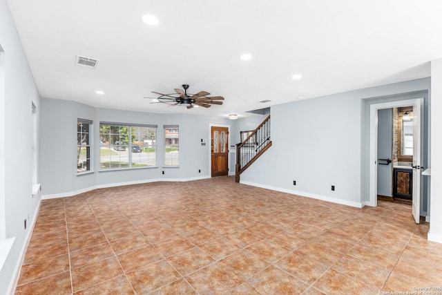 unfurnished living room with recessed lighting, visible vents, baseboards, and stairs