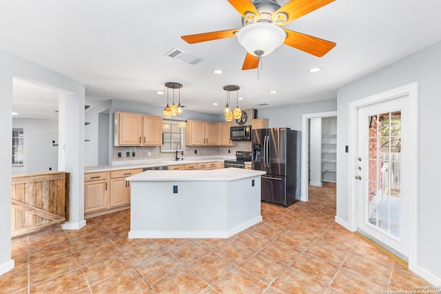 kitchen featuring visible vents, light brown cabinetry, light countertops, decorative backsplash, and black appliances