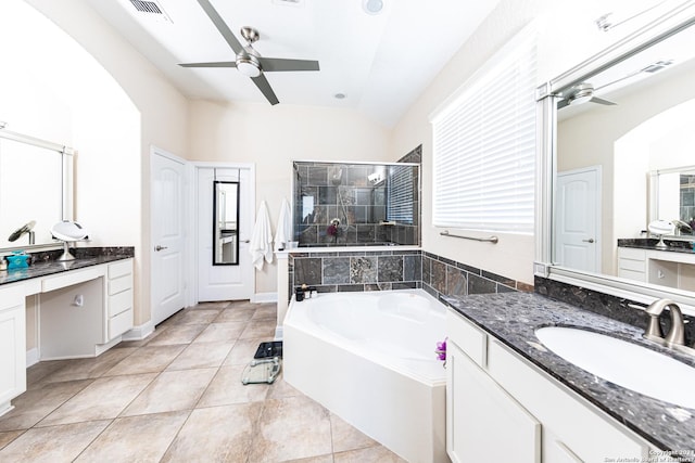 bathroom with visible vents, ceiling fan, a garden tub, a stall shower, and a sink