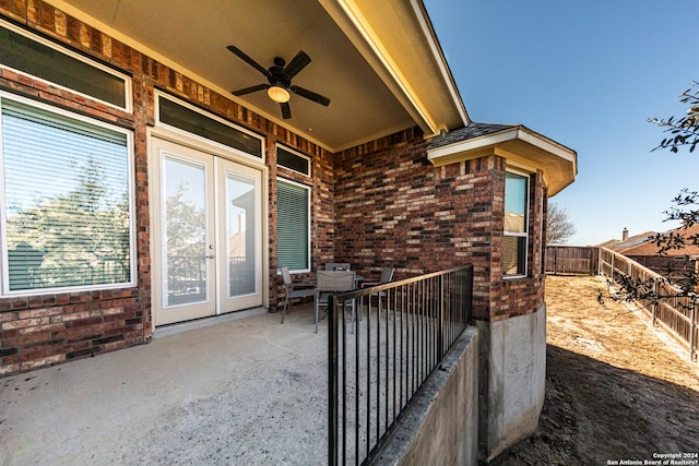 view of patio / terrace with fence, french doors, and ceiling fan