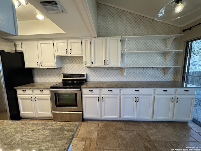 kitchen featuring open shelves, stone finish flooring, appliances with stainless steel finishes, white cabinets, and lofted ceiling