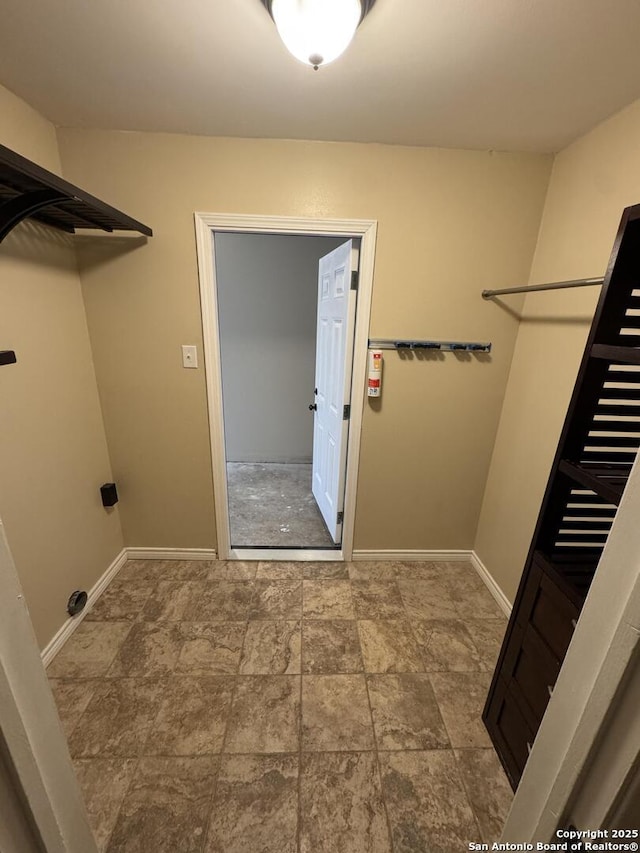 laundry room with baseboards and laundry area