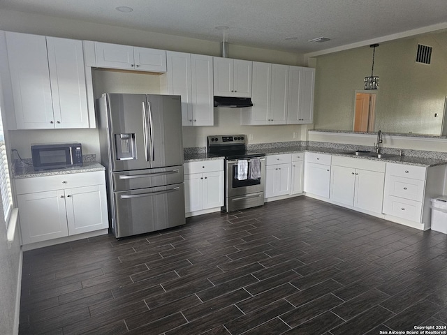 kitchen featuring white cabinetry, under cabinet range hood, appliances with stainless steel finishes, and a sink