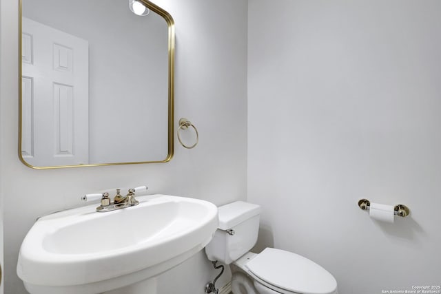 bathroom with a sink and toilet