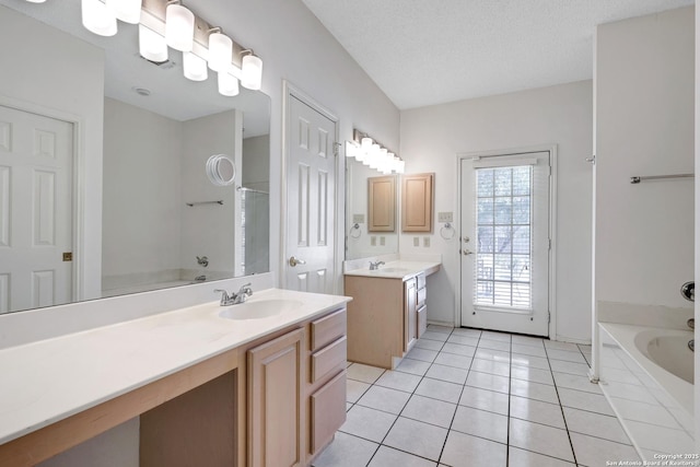 full bath with a shower with shower curtain, a bathing tub, a sink, a textured ceiling, and tile patterned floors