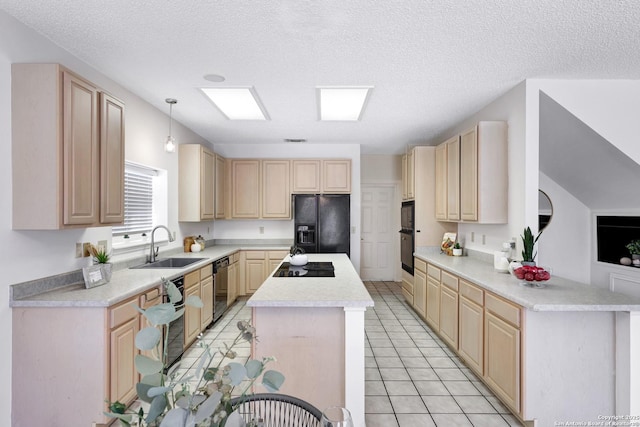 kitchen with black appliances, light brown cabinets, light countertops, and a center island