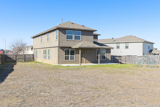 back of house with a patio area and a fenced backyard