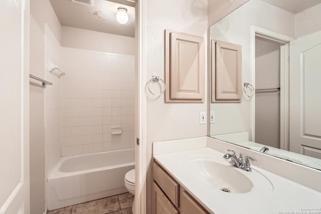 bathroom with tile patterned floors, tub / shower combination, toilet, and vanity