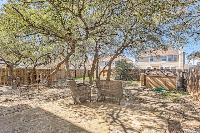 view of yard with a fenced backyard and a patio area