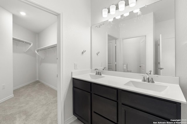 13210 Club House Blvd, San Antonio, TX 78221 - full bath with double vanity, a spacious closet, and baseboards