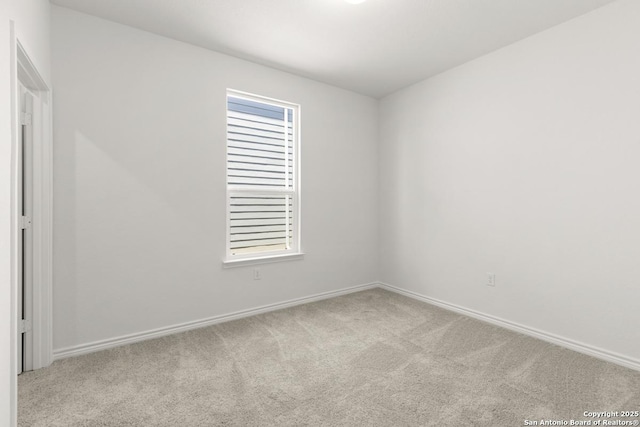 13210 Club House Blvd, San Antonio, TX 78221 - carpeted empty room with baseboards and healthy amount of natural light