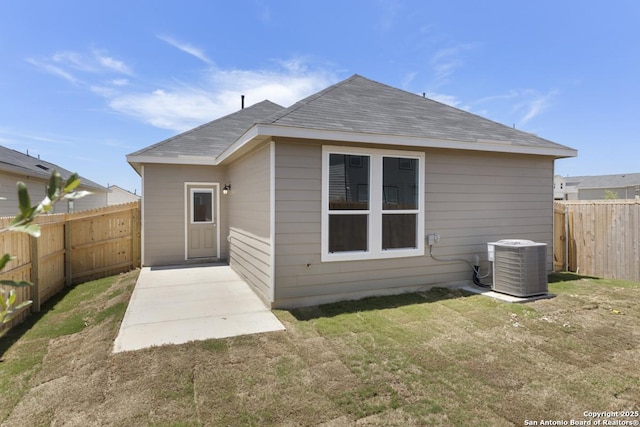 13210 Club House Blvd, San Antonio, TX 78221 - back of house featuring central AC unit, a patio, and roof with shingles