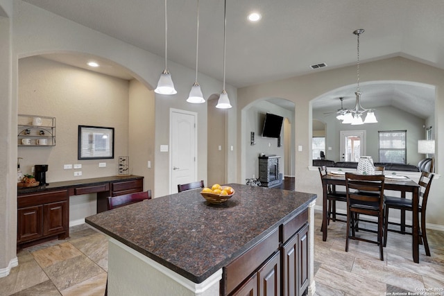 kitchen featuring visible vents, open floor plan, recessed lighting, lofted ceiling, and hanging light fixtures