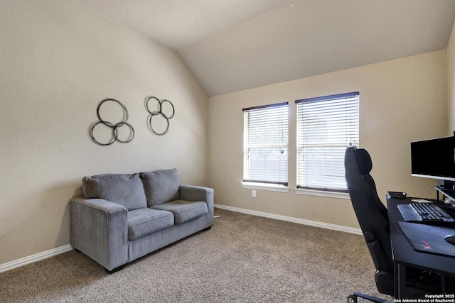 office area with vaulted ceiling, carpet, and baseboards