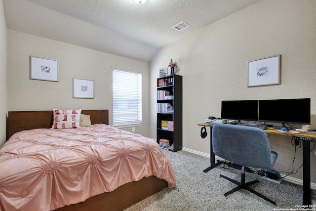 carpeted bedroom with lofted ceiling, baseboards, visible vents, and a textured ceiling