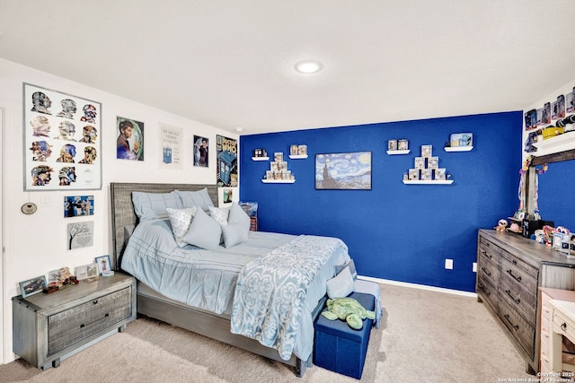 bedroom featuring baseboards and carpet floors