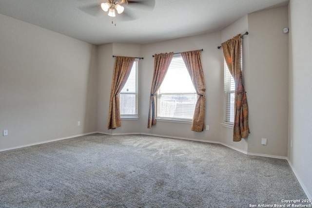 unfurnished room featuring baseboards, a ceiling fan, and carpet floors