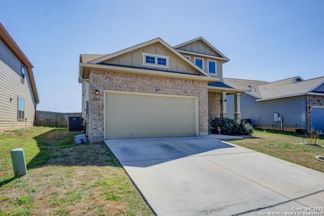 view of front of house with brick siding, board and batten siding, central air condition unit, a garage, and driveway