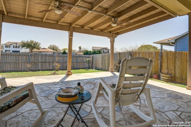 view of patio / terrace with a fenced backyard and ceiling fan