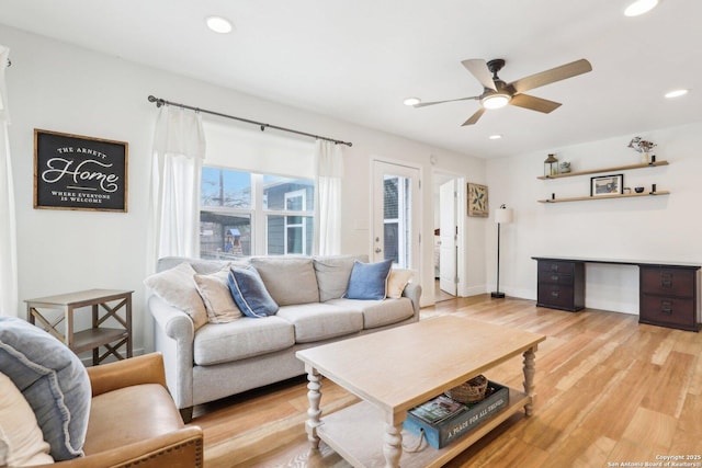 living area with light wood finished floors, recessed lighting, baseboards, and a ceiling fan