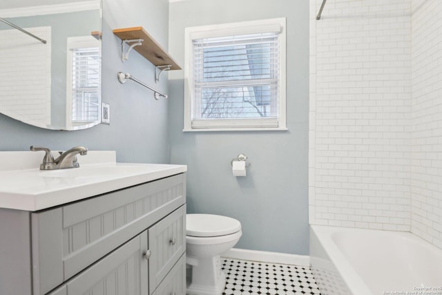 full bath with vanity, baseboards, bathtub / shower combination, tile patterned floors, and toilet