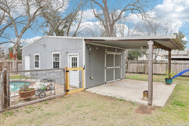 view of outbuilding with an outdoor structure and a fenced backyard