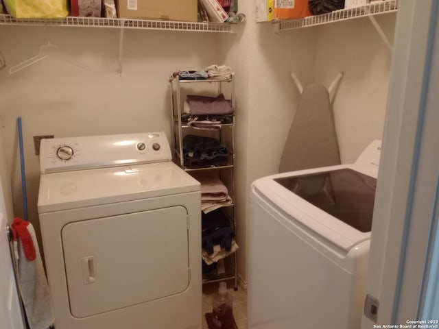 laundry area featuring laundry area and washer and clothes dryer