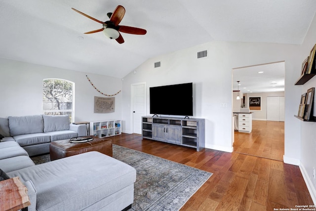 living room featuring hardwood / wood-style flooring, visible vents, lofted ceiling, and ceiling fan