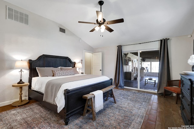 bedroom featuring access to exterior, visible vents, lofted ceiling, and wood finished floors