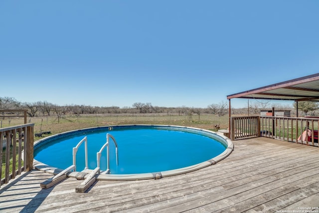 outdoor pool with a wooden deck