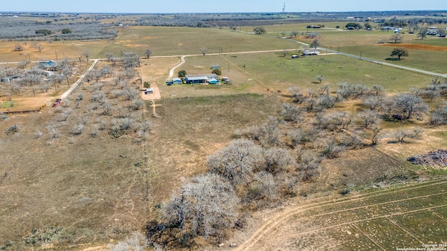 birds eye view of property with a rural view