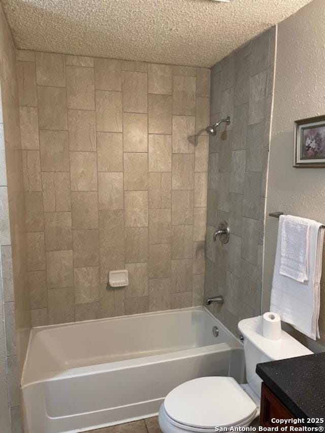 bathroom with toilet, a textured ceiling, washtub / shower combination, vanity, and a textured wall