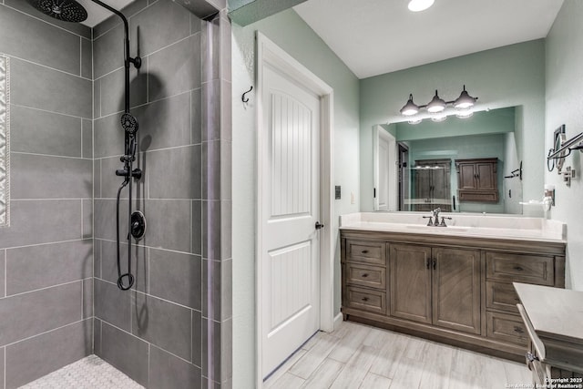 5918 Oak Country Way, San Antonio, TX 78247 - full bath with a tile shower, wood finished floors, and vanity