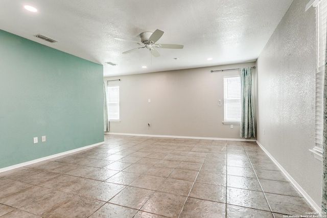 5918 Oak Country Way, San Antonio, TX 78247 - spare room featuring a ceiling fan, baseboards, a healthy amount of sunlight, and visible vents