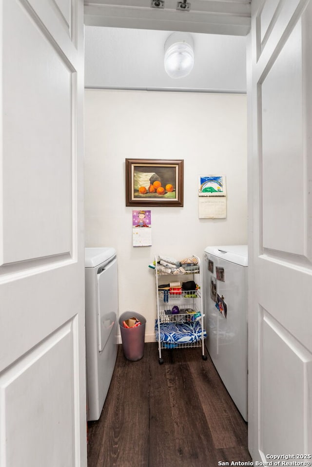 laundry room with laundry area, dark wood-style floors, and separate washer and dryer