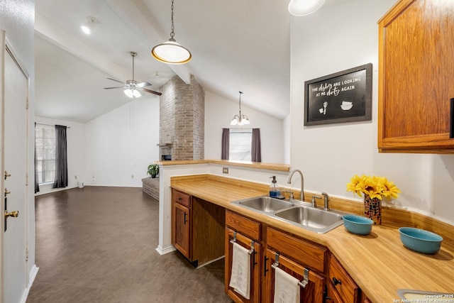 kitchen featuring a sink, vaulted ceiling with beams, ceiling fan, and brown cabinetry