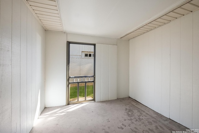 unfurnished room featuring concrete flooring