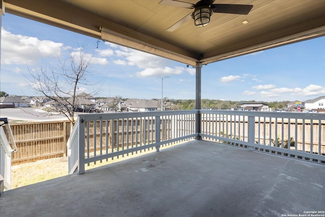 view of patio / terrace with a residential view and a ceiling fan