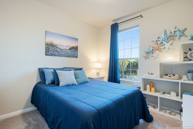 carpeted bedroom with baseboards