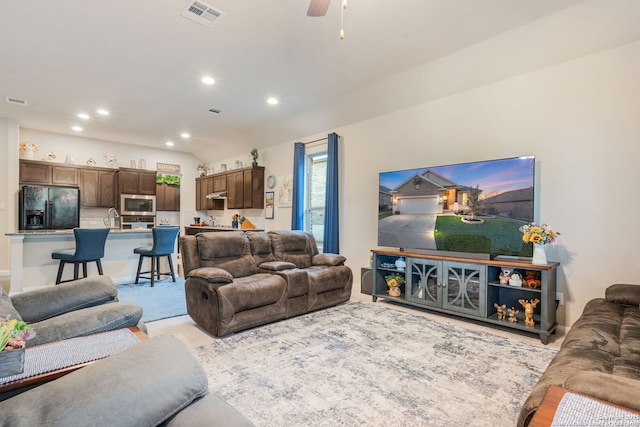 living room featuring recessed lighting, visible vents, and a ceiling fan