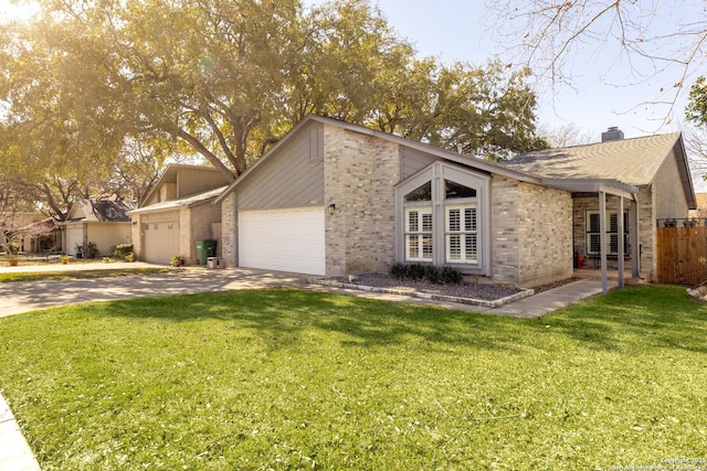 view of front of home with fence, driveway, an attached garage, a front lawn, and brick siding