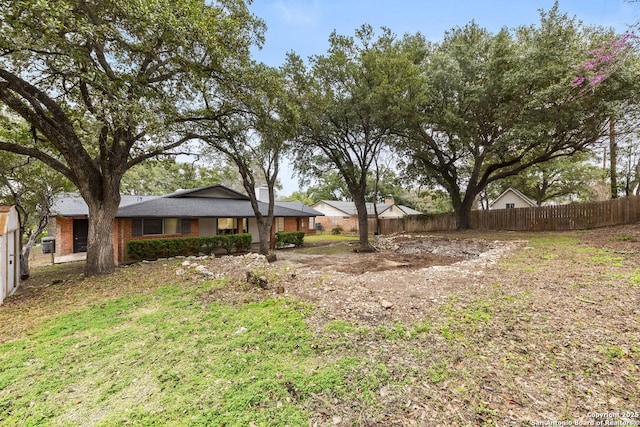 view of yard with fence